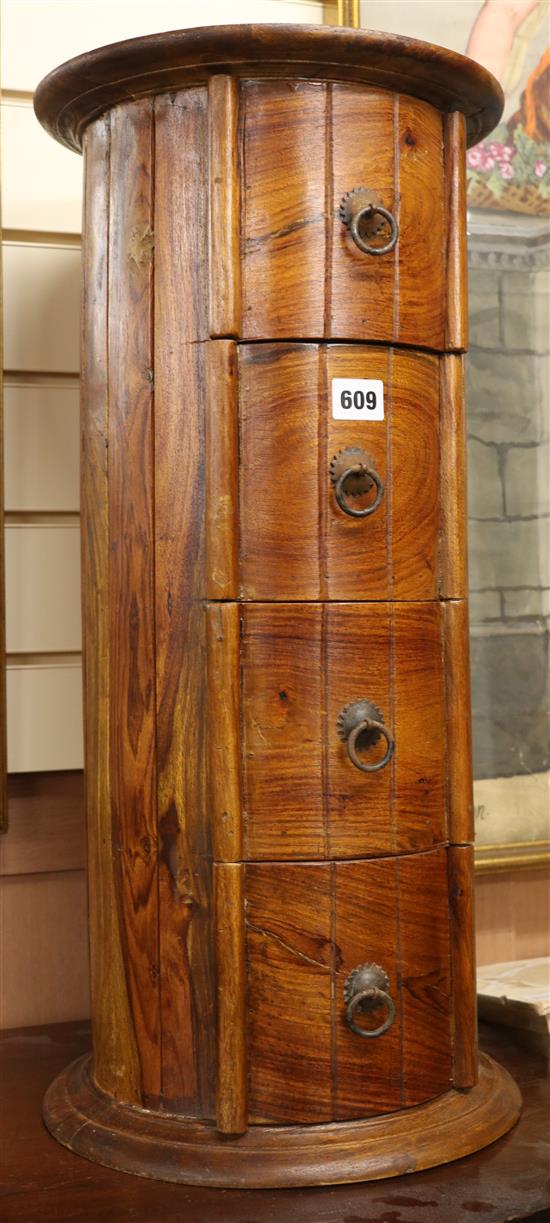 A cylinder hardwood pedestal chest